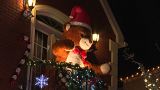 Animated bear on balcony of decorated house