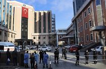 Police and medics gather outside the privately-run Sanko University Hospital in Gaziantep, southeastern Turkey, Saturday, Dec. 19, 2020