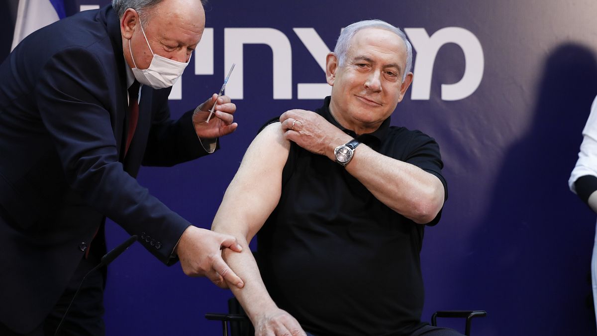Israeli Prime Minister Minister Benjamin Netanyahu receives a coronavirus vaccine at Sheba Medical Center in Ramat Gan, Israel on Saturday, Dec. 19, 2020