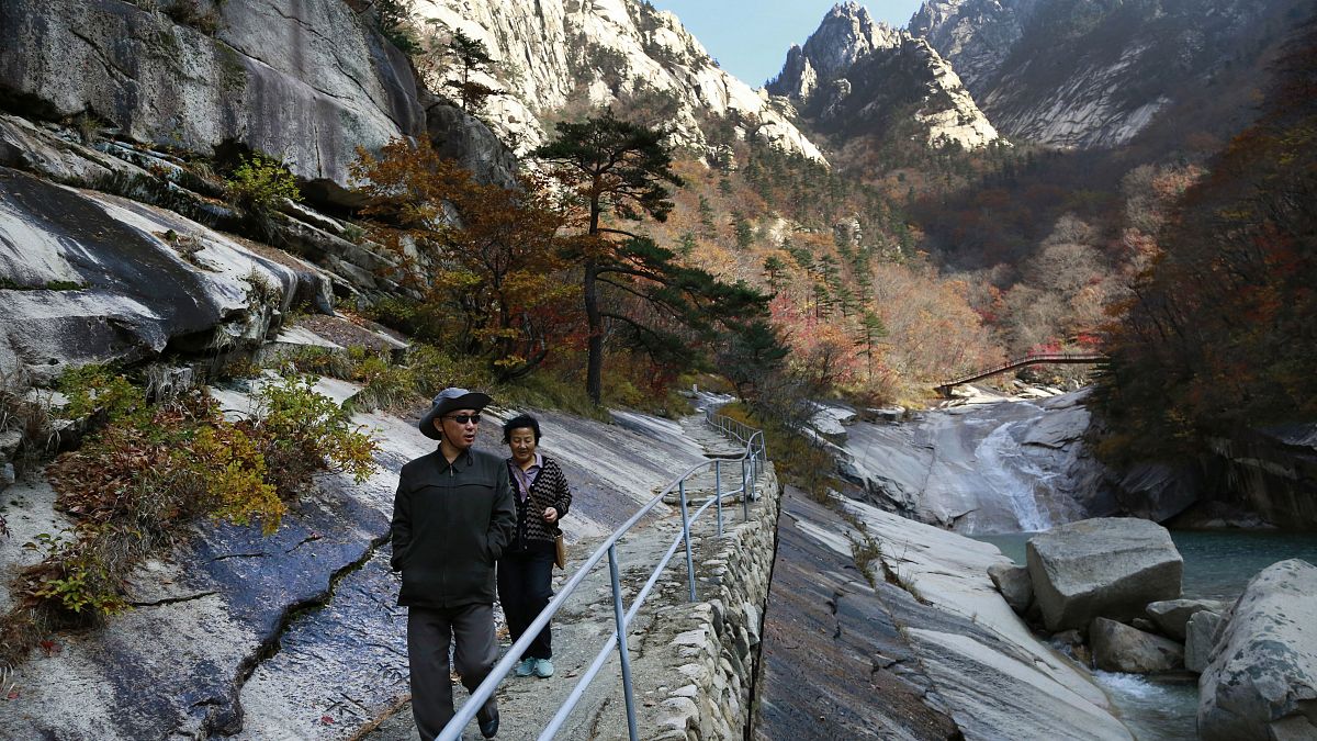n this Oct. 23, 2018, file photo, local tourists walk on the trail at Mount Kumgang, known as Diamond Mountain, in North Korea