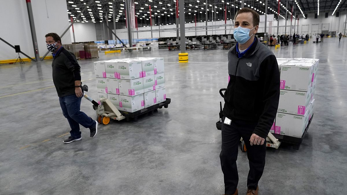 Boxes containing the Moderna COVID-19 vaccine are moved to the loading dock for shipping at the McKesson distribution center in Olive Branch, Miss., Sunday, Dec. 20, 2020