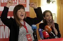 Irma Baralija greets supporters in her headquarters after local election in Mostar, Bosnia, Sunday, Dec. 20, 2020.