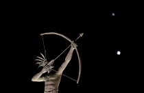 A statue in Kansas, with Saturn (top) and Jupiter in the night sky