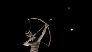 A statue in Kansas, with Saturn (top) and Jupiter in the night sky