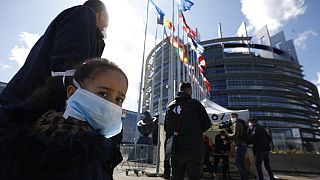 People wait in line to be tested for the COVID-19 outside the European Parliament in Strasbourg, eastern France, Tuesday, May 12, 2020.