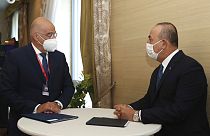 Greek Foreign Minister Nikos Dendias, left, meets with Turkey's Foreign Minister Mevlut Cavusoglu