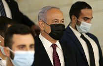 Israeli prime minister Benjamin Netanyahu, centre, arrives at the Israeli Knesset (Parliament).