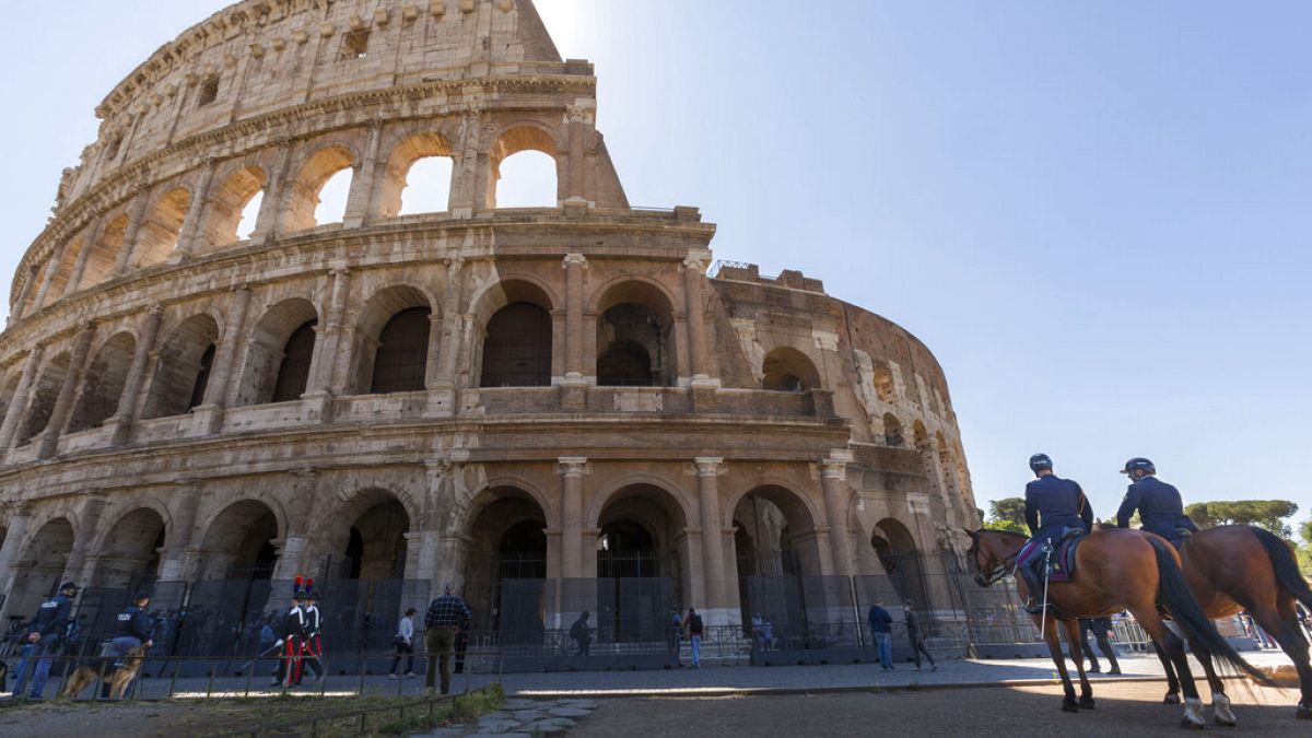 FILE: Mounted policemen and Carabinieri outside the Colosseum in Rome, June 1, 2020.
