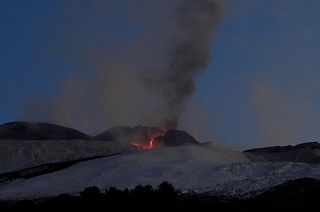 Eruption and flowing lava coming from crater on Mt. Edna