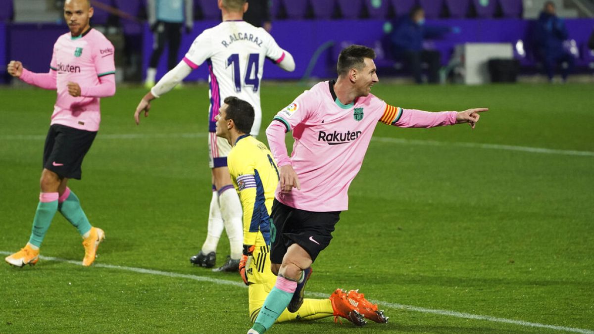 Barcelona's Lionel Messi celebrates after scoring his side's third goal during a Spanish La Liga soccer match between Valladolid and Barcelona