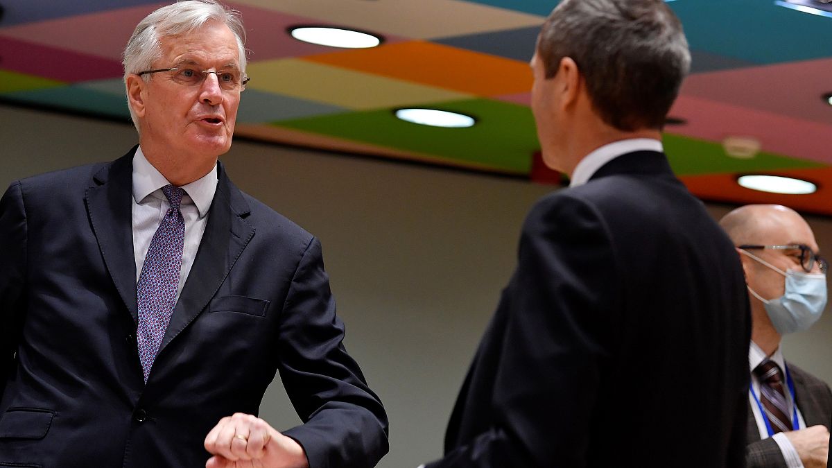 European Union's chief Brexit negotiator Michel Barnier, left, speaks with Ambassador Michael Clauss, Permanent Representative of Germany to the European Union, during a meeti