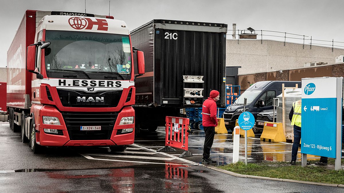 Trucks wait outside of loading bays at Pfizer Manufacturing in Puurs, Belgium