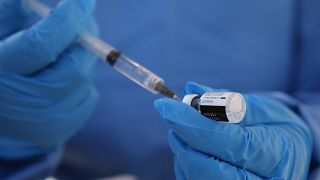 A health worker extracts a dose of the COVID-19 vaccine at the military base in Queretaro, Mexico, Thursday, Dec. 24, 2020. 