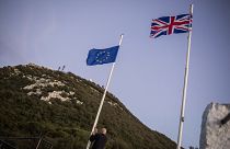 A worker lowers the EU flag at the British territory of Gibraltar, Friday Jan. 31, 2020.