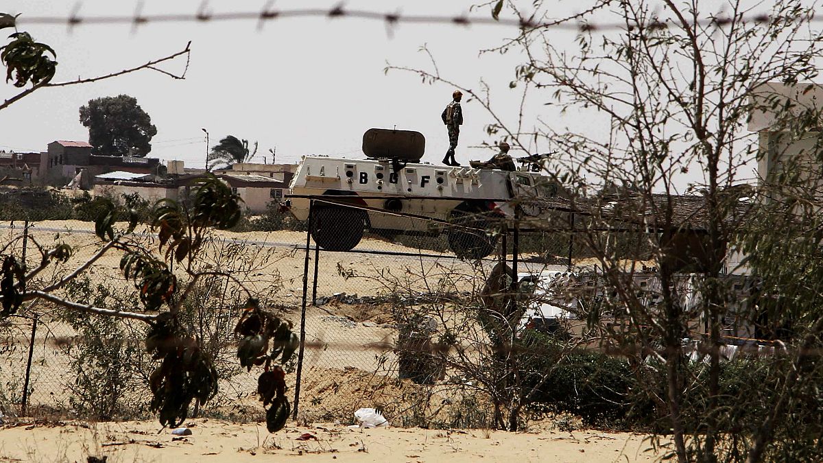 In this Monday, Aug. 6, 2012 file photo, Egyptian border guards patrol near the border with Israel in Rafah, Egypt