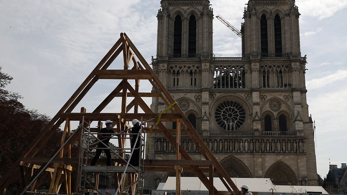 FILE PHOTO Carpenters put the skills of their Medieval colleagues on show on the plaza in front of Notre Dame Cathedral in Paris, France, Sept. 19, 2020