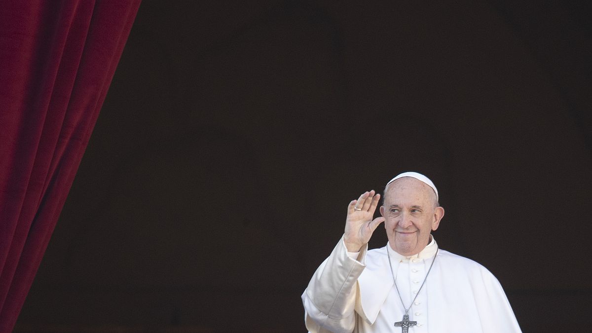 FILE - Pope Francis waves to faithful and pilgrims after he delivered the Urbi et Orbi Christmas' day blessing at the Vatican, Wednesday, Dec. 25, 2019. 