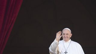 FILE - Pope Francis waves to faithful and pilgrims after he delivered the Urbi et Orbi Christmas' day blessing at the Vatican, Wednesday, Dec. 25, 2019. 