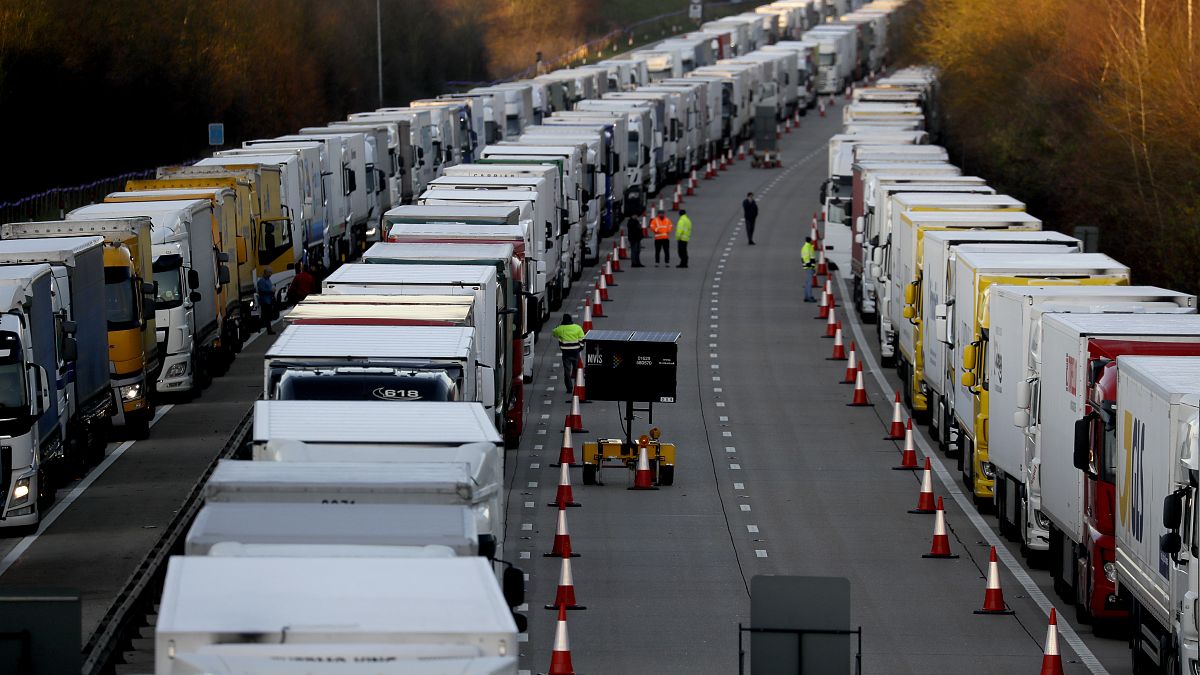 Trucks are parked up on the M20, part of Operation Stack in Ashford, Kent, England, Friday, Dec. 25, 2020. 