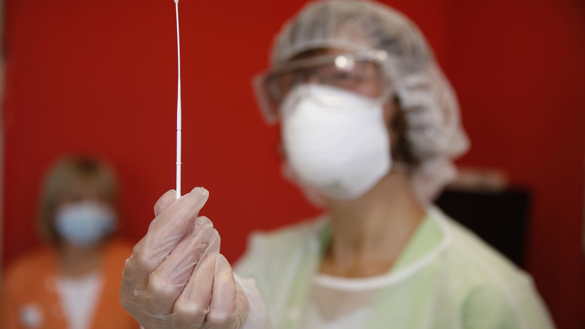 FILE PHOTO - A nurse prepares an antigen speed test in a nursing home in Ammerschwihr, eastern France, Monday, Nov.9, 2020.
