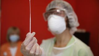 FILE PHOTO - A nurse prepares an antigen speed test in a nursing home in Ammerschwihr, eastern France, Monday, Nov.9, 2020.
