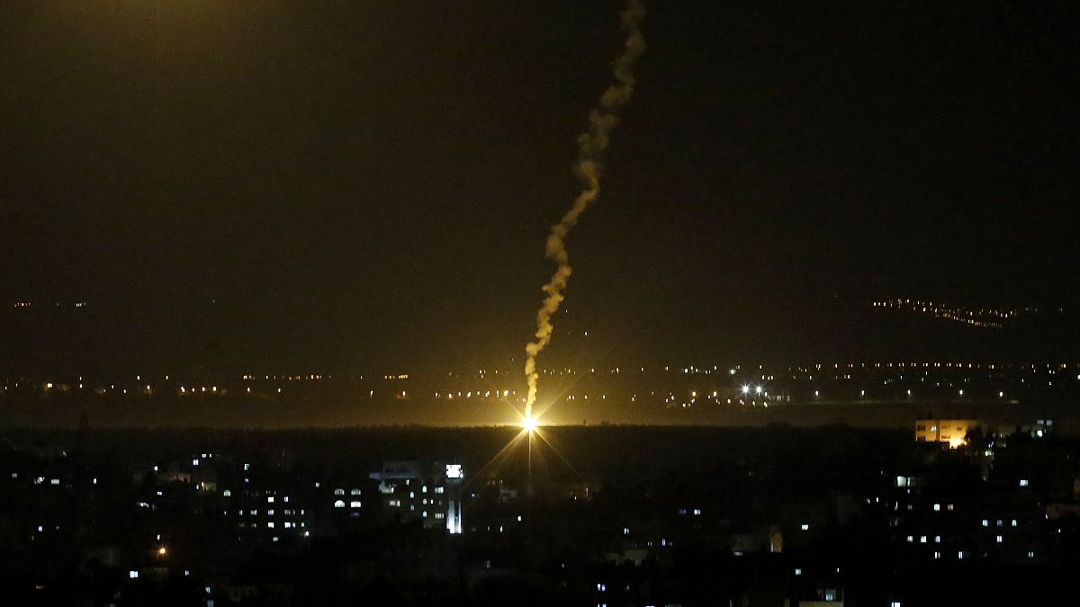 FILE PHOTO - Flares fired from Israeli forces light up the night sky in Gaza City, Monday, Nov. 12, 2018