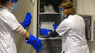 Medical staff receive part of a Pfizer-BioNTech Covid-19 vaccine shipment at the UZ Leuven hospital in Leuven, Belgium, Dec. 26, 2020.