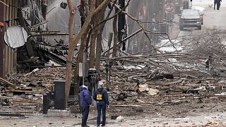 Emergency personnel work near the scene of an explosion in downtown Nashville, Tenn., Friday, Dec. 25, 2020.