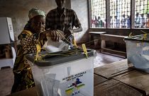 A woman casts her vote after polls opened for presidential and legislative elections in the capital Bangui, Central African Republic.
