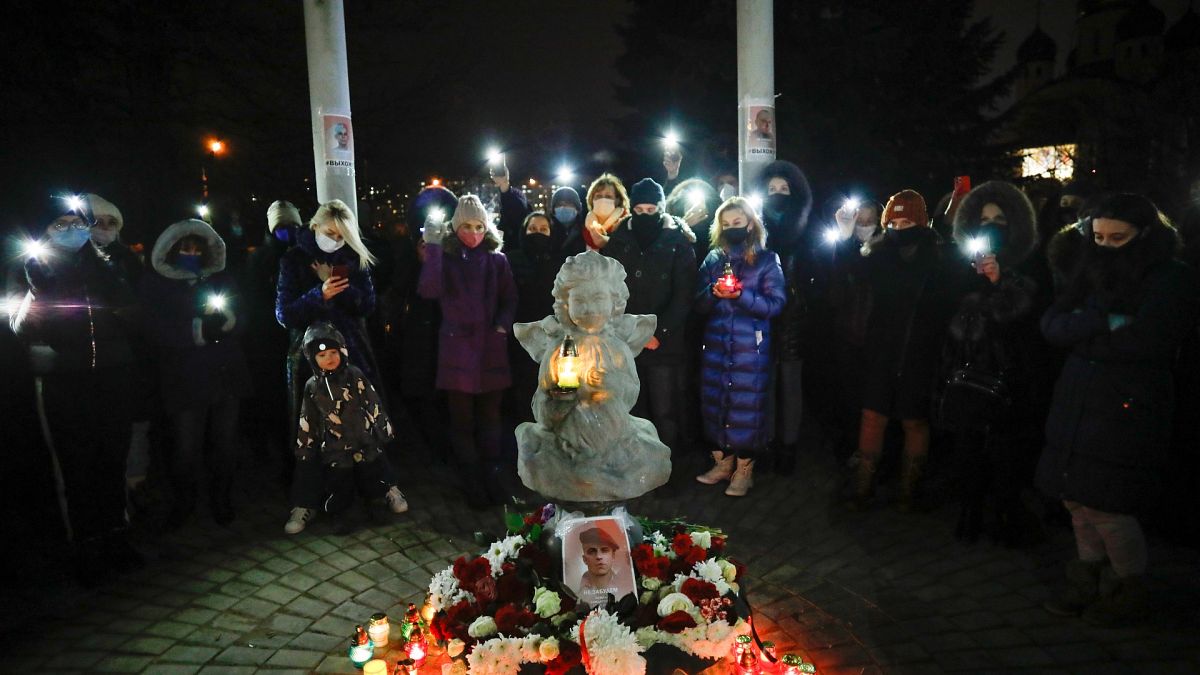 People commemorate Roman Bondarenko, an anti-government protester who died after what witnesses said was a severe beating by security forces, Dec. 21, 2020