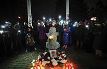 People commemorate Roman Bondarenko, an anti-government protester who died after what witnesses said was a severe beating by security forces, Dec. 21, 2020