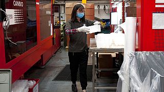 In this photo taken on Monday, Feb. 18, 2019, staff work at GoodFish, an injection molding business that supplies the auto industry, at their factory in Cannock, England. 