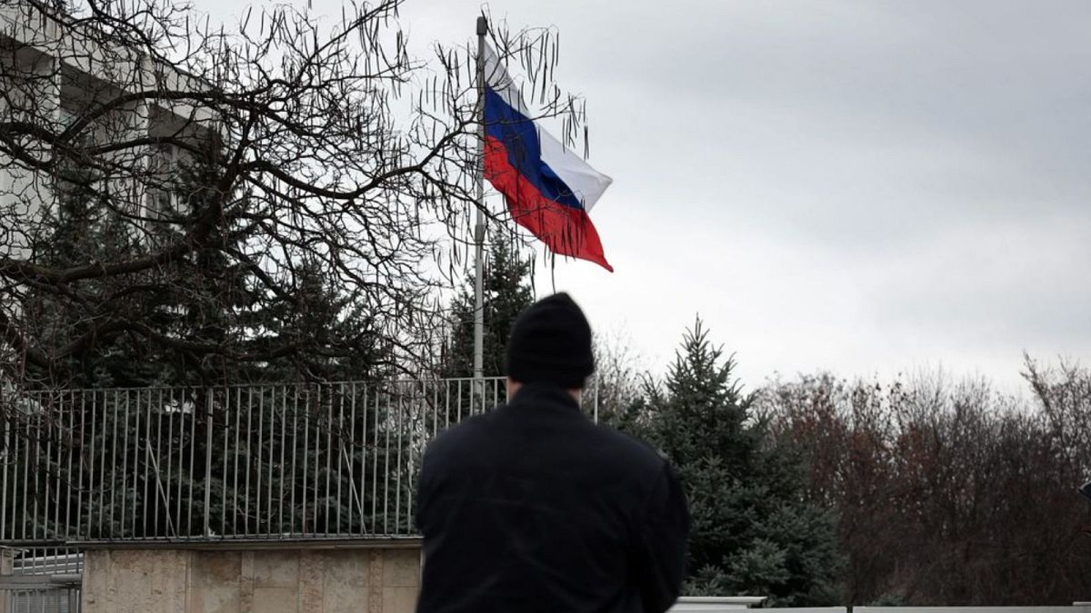 A Bulgarian police officer stands in front of Russian embassy in Sofia.