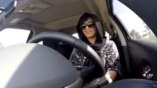 Loujain al-Hathloul drives a car in 2014 from the UAE to Saudi Arabia in a livestream to protest the kingdom's ban on women driving.