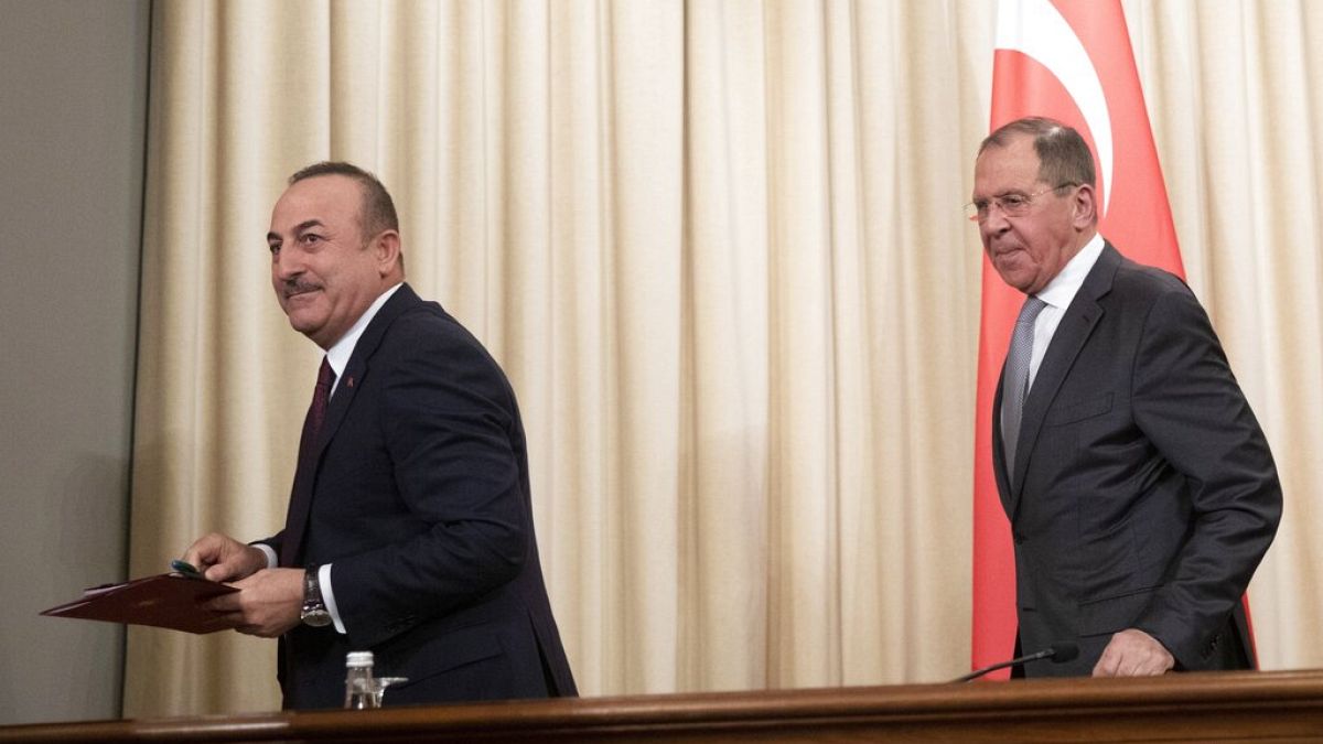 Turkish Foreign Minister Mevlut Cavusoglu, left, and Russian Foreign Minister Sergey Lavrov