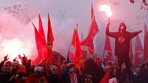 People shout slogans during a protest against the new government in Podgorica, Montenegro, Monday, Dec. 28, 2020.