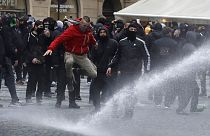 Water canon is used against demonstrators as they gather to protest against the COVID-19 restrictive measures at Old Town Square in Prague, Czech Republic