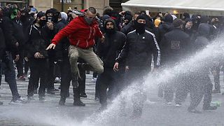 Water canon is used against demonstrators as they gather to protest against the COVID-19 restrictive measures at Old Town Square in Prague, Czech Republic