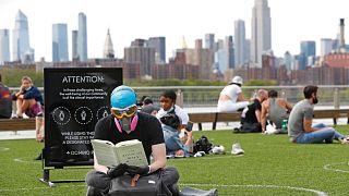 Social distancing at Domino Park in the Williamsburg borough of Brooklyn, Monday, May 18, 2020, in New York. 