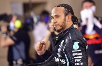 Nov. 29, 2020, Lewis Hamilton of Britain celebrates after wining the Formula One race in Bahrain International Circuit in Sakhir. (Giuseppe Cacace, Pool via AP, File)