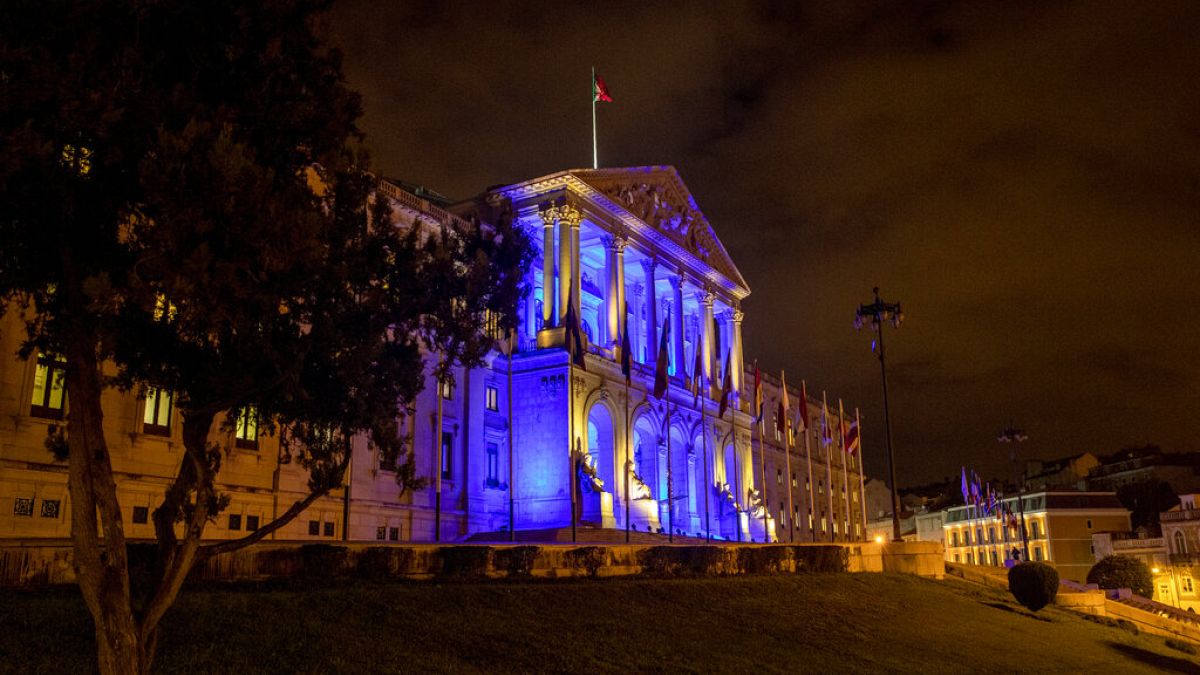 The Portuguese parliament building in Lisbon is illuminated to mark the start of the Portuguese Presidency of the Council of the EU 2021