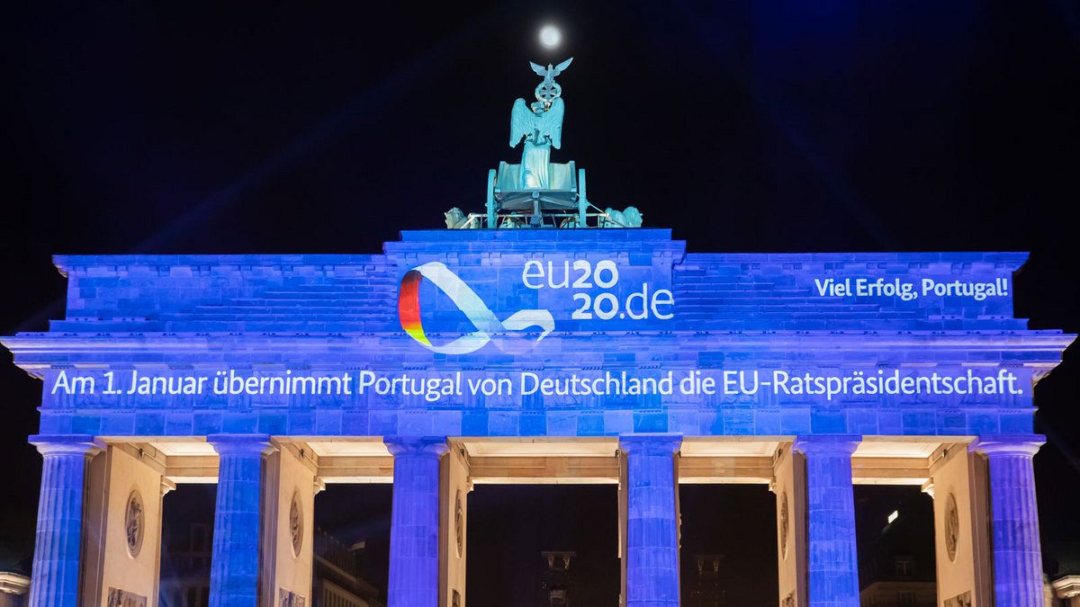The Brandenburg Gate illuminated with a projection marking the end of the German EU presidency and the handover to Portugal, December 31, 2020 in Berlin.