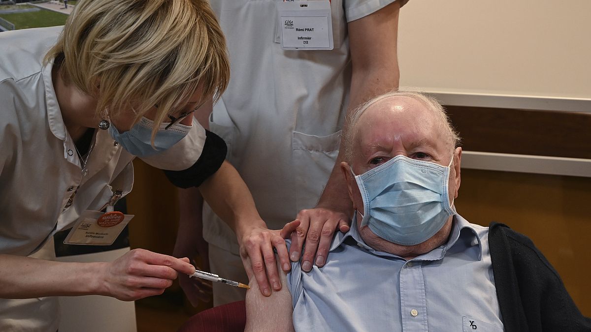 Alain a French 92-year-old man receives a dose of the Pfizer-BioNTech Covid-19 vaccine.