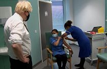 British prime minister Boris Johnson watching nurse receiving vaccine