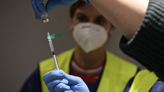 A health worker prepares a Pfizer coronavirus vaccine