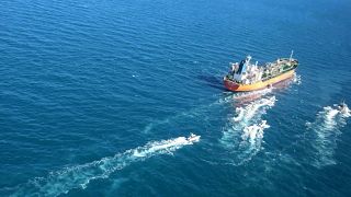 In this photo released Monday, Jan. 4, 2021, by Tasnim News Agency, the MT Hankuk Chemi, a South Korean-flagged tanker is escorted by Iranian Revolutionary Guard boats.