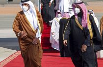 Saudi Arabia's Crown Prince Mohammed bin Salman, right, welcomes Qatar's Emir Sheikh Tamim bin Hamad al-Thani upon his arrival to attend the Gulf Cooperation Council's summit.