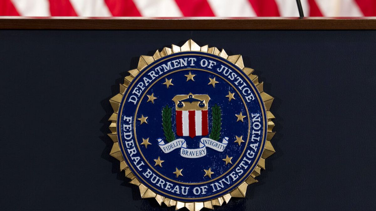 The FBI seal is seen before a news conference at FBI headquarters in Washington