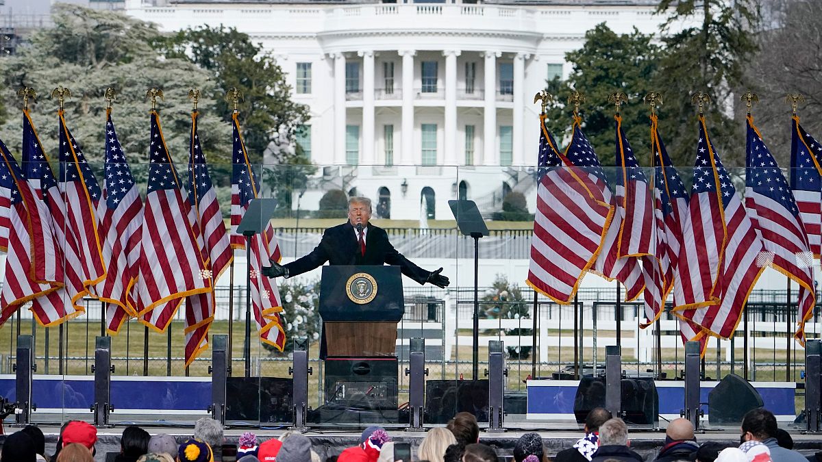 With the White House in the background, President Donald Trump speaks at a rally Wednesday, Jan. 6,