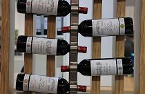 Red wine bottles of the region of Medoc, western France, are displayed at the wine fair in Paris in February 2020.